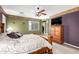 Stylish main bedroom boasts accent wall, ceiling fan, and a walk-in closet at 5707 N Kristi Ln, Litchfield Park, AZ 85340