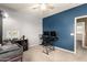 Office space with two desks, blue and gray walls, and natural light from the window at 5707 N Kristi Ln, Litchfield Park, AZ 85340