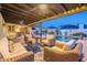 Spacious backyard with covered patio, comfortable seating, and a refreshing pool for outdoor enjoyment at 603 W Keats Ave, Mesa, AZ 85210