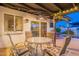 Back patio with outdoor seating, ceiling fan, and view of pool and garden; relaxing outdoor living at 603 W Keats Ave, Mesa, AZ 85210