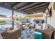 Comfortable backyard patio with stylish seating, outdoor grill and hot tub at 603 W Keats Ave, Mesa, AZ 85210