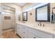 Stylish bathroom with double sinks, large mirrors, and a separate shower area at 603 W Keats Ave, Mesa, AZ 85210