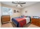 Bedroom with ceiling fan, natural lighting and patriotic themed bedding at 603 W Keats Ave, Mesa, AZ 85210