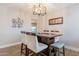 Modern dining room with stylish light fixture, wood table and seating at 603 W Keats Ave, Mesa, AZ 85210
