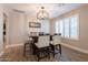Dining room boasts modern lighting and wood-look tile flooring at 603 W Keats Ave, Mesa, AZ 85210
