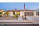 Inviting exterior of a single-story home, landscaped yard, and American flag, offering charm and curb appeal at 603 W Keats Ave, Mesa, AZ 85210