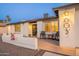Inviting front of home with covered porch, attractive facade, and well-lit entrance for added security at 603 W Keats Ave, Mesa, AZ 85210