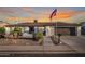 Charming single-story home featuring a landscaped front yard and an American flag at 603 W Keats Ave, Mesa, AZ 85210