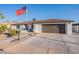 A beautiful single-story home with a well-manicured lawn and an inviting driveway at 603 W Keats Ave, Mesa, AZ 85210