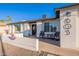 Inviting front porch with chairs and a modern door, perfect for relaxing outdoors at 603 W Keats Ave, Mesa, AZ 85210