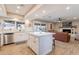 Open kitchen with island, stainless appliances and seamless to living room at 603 W Keats Ave, Mesa, AZ 85210