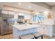 Bright updated kitchen with white cabinets, stainless steel appliances, quartz countertops, and stylish decor at 603 W Keats Ave, Mesa, AZ 85210