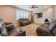Cozy living room with leather couches, fireplace, and plantation shutters at 603 W Keats Ave, Mesa, AZ 85210