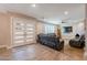 Welcoming living room with a fireplace, shutters, and leather sofa sets at 603 W Keats Ave, Mesa, AZ 85210