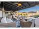 Charming covered patio overlooking a sparkling pool and lush backyard at 603 W Keats Ave, Mesa, AZ 85210