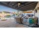 Inviting covered patio with comfortable seating, outdoor kitchen, and a refreshing pool view at 603 W Keats Ave, Mesa, AZ 85210