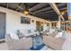 Relaxing covered patio with comfortable seating, ceiling fans, and a great view at 603 W Keats Ave, Mesa, AZ 85210