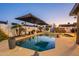 Beautiful swimming pool with mature landscaping and sun umbrellas that provides an oasis for outdoor relaxation at 603 W Keats Ave, Mesa, AZ 85210