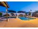 Backyard swimming pool with a diving board is surrounded by a large patio at 603 W Keats Ave, Mesa, AZ 85210