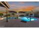 Beautiful pool and patio area under a colorful sunset at 603 W Keats Ave, Mesa, AZ 85210
