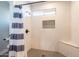 Modern shower with a glass door, rain shower head, and stylish tile work at 603 W Keats Ave, Mesa, AZ 85210