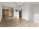 Spacious, tiled bedroom offers a closet with custom built-ins, a laundry nook and neutral colors at 610 E Roosevelt St # 145, Phoenix, AZ 85004