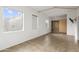 Spacious bedroom featuring large windows, tile flooring and custom closet with sliding doors at 610 E Roosevelt St # 145, Phoenix, AZ 85004