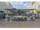 Outdoor area featuring a mural, trellis, and sitting area for residents at 610 E Roosevelt St # 145, Phoenix, AZ 85004
