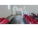 Clean garage with stacked red chairs and tables at 610 E Roosevelt St # 145, Phoenix, AZ 85004