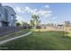 Expansive grassy area perfect for outdoor activities, complemented by lush trees and well-kept landscaping at 610 E Roosevelt St # 145, Phoenix, AZ 85004