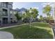 Beautifully landscaped green space with mature trees and walking paths, providing a peaceful retreat within the community at 610 E Roosevelt St # 145, Phoenix, AZ 85004
