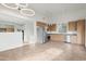A large kitchen with stainless steel appliances, wood cabinets, gray countertops and tile floors at 610 E Roosevelt St # 145, Phoenix, AZ 85004
