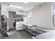 Bright prep kitchen with stainless steel countertops, shelving, and natural lighting at 610 E Roosevelt St # 145, Phoenix, AZ 85004