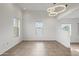 Bright, open living space featuring tile flooring, neutral walls, and multiple windows at 610 E Roosevelt St # 145, Phoenix, AZ 85004