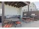 Outdoor kitchen with stainless steel grills, sink, and tables for convenient outdoor cooking and dining at 610 E Roosevelt St # 145, Phoenix, AZ 85004