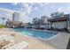 Resort-style pool with lounge chairs, seating areas, and BBQ, near retail and dining in the community at 610 E Roosevelt St # 145, Phoenix, AZ 85004