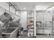 Storage area with industrial shelving, large sink, and large commercial refrigerator at 610 E Roosevelt St # 145, Phoenix, AZ 85004