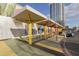 Street view of a public space with colorful seating and a nearby high-rise building at 610 E Roosevelt St # 145, Phoenix, AZ 85004
