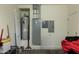 Utility area featuring a water heater and electrical panel at 610 E Roosevelt St # 145, Phoenix, AZ 85004