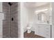 Nicely tiled shower and modern vanity add style to this renovated bathroom at 619 S Essex Ln, Mesa, AZ 85208