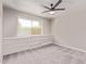 Neutrally painted bedroom with soft carpet and built in shelving at 619 S Essex Ln, Mesa, AZ 85208