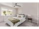 Comfortable bedroom with soft carpet, fan, and natural light at 619 S Essex Ln, Mesa, AZ 85208