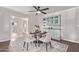 Dining room featuring hardwood flooring, a round table for four, and a decorative hutch at 619 S Essex Ln, Mesa, AZ 85208