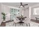 Stylish dining room with a decorative hutch, round table for four, and modern decor at 619 S Essex Ln, Mesa, AZ 85208