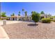 Charming single-story home featuring desert landscaping, covered porch, and shade awnings at 619 S Essex Ln, Mesa, AZ 85208