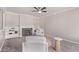 Bright living room with a fireplace, built-in shelves, a ceiling fan and modern decor at 619 S Essex Ln, Mesa, AZ 85208