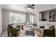 Inviting living room with large window, neutral furniture, and stylish decor at 619 S Essex Ln, Mesa, AZ 85208
