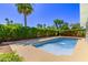 Backyard pool surrounded by lush greenery and palm trees at 619 S Essex Ln, Mesa, AZ 85208