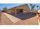 Charming covered patio and paved walkway enhance the spacious backyard, perfect for outdoor relaxation at 6255 S Opal Dr, Chandler, AZ 85249