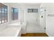 Bright bathroom featuring a glass shower, soaking tub and modern fixtures at 6255 S Opal Dr, Chandler, AZ 85249